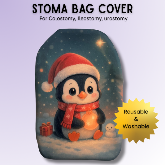 Adorable festive penguin stoma bag cover wearing a Santa hat and scarf, holding a glowing bauble in the snow – cute Christmas ostomy cover.