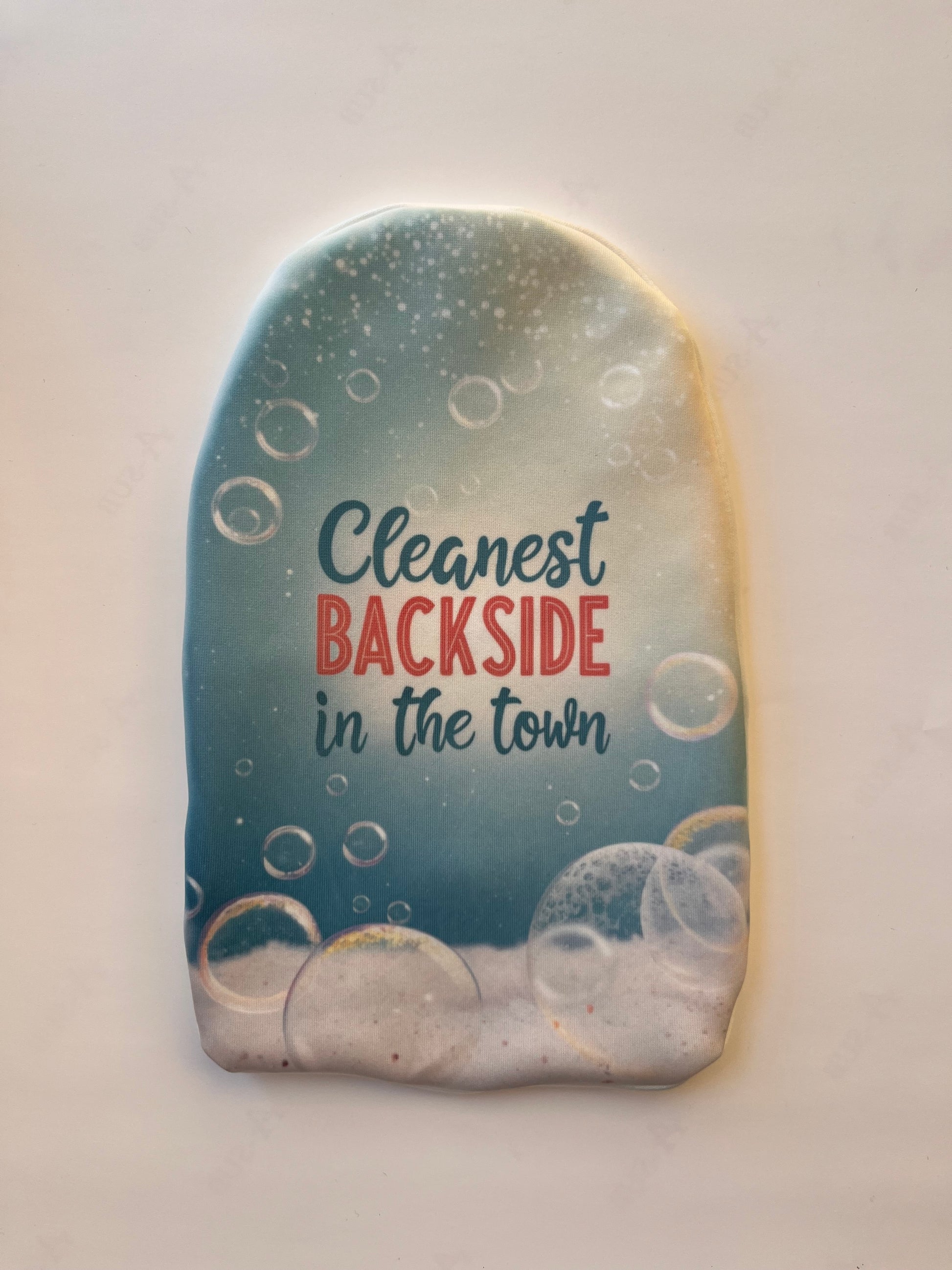 Cheeky stoma pouch with "Cleanest backside in the town" slogan – lighthearted ostomy cover with fun messaging.