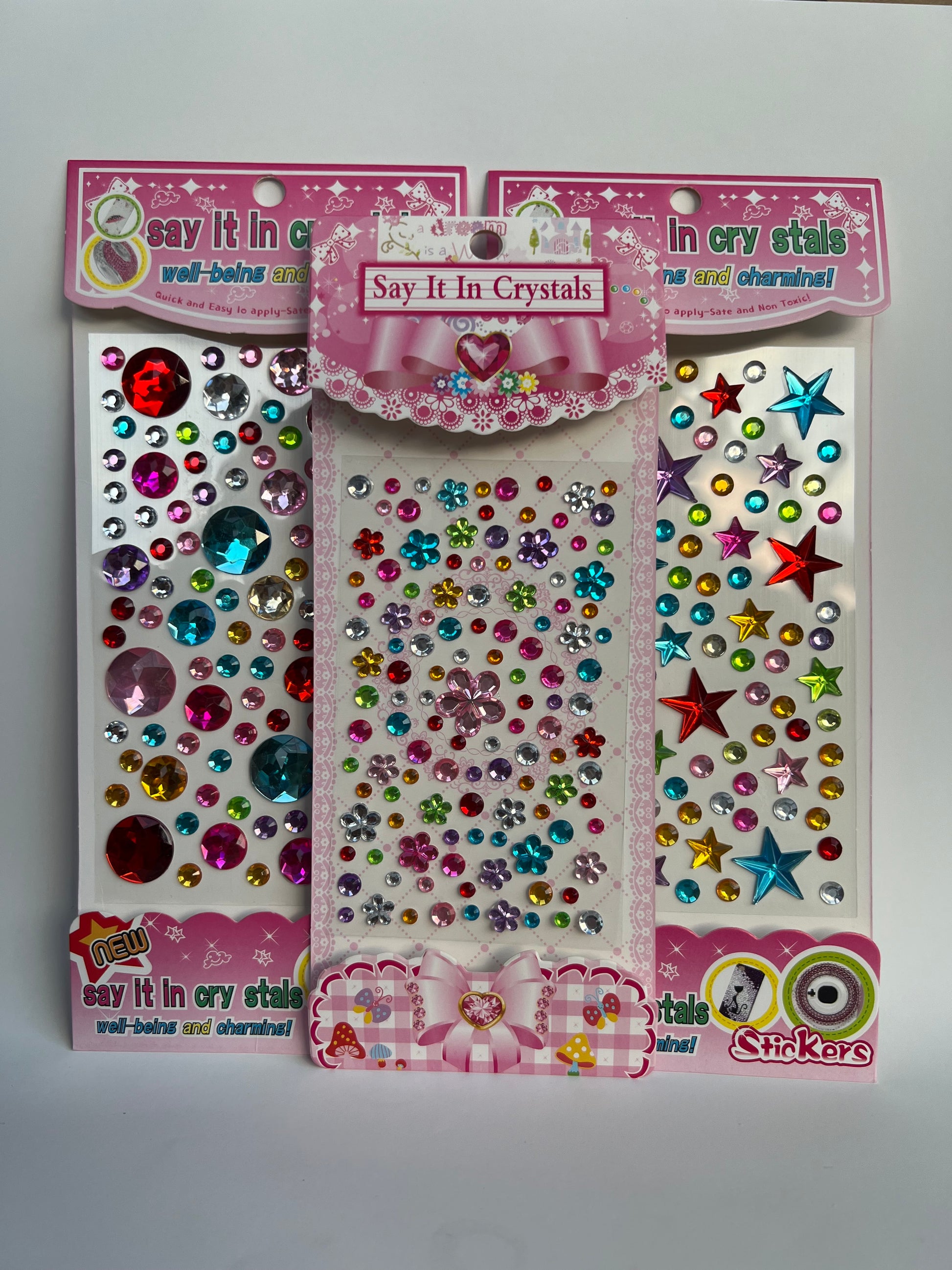 Sparkly self-adhesive craft gem stickers — colorful rhinestones for decorating stoma covers or journals.