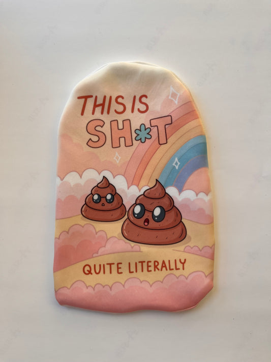 Colorful rainbow-themed stoma cover with "This is sh*t" slogan – bold and funny ostomy pouch with pride-inspired design.